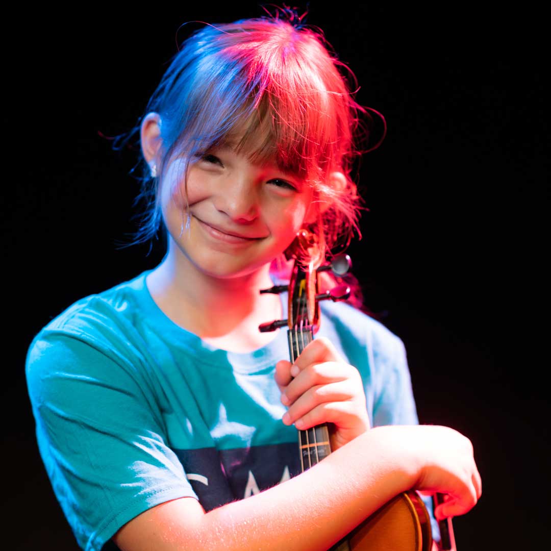 Photo of Charlie Peavy with her violin