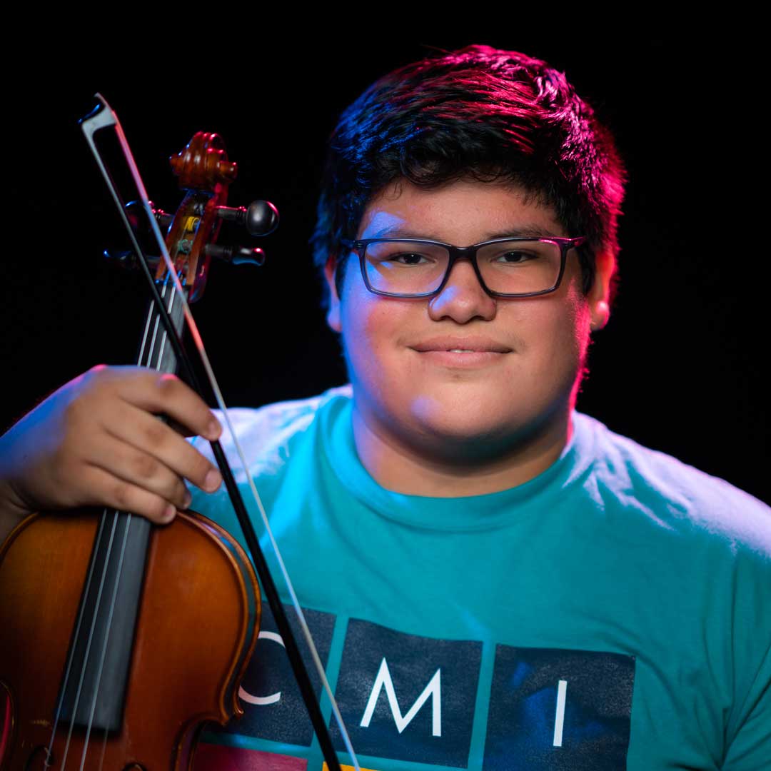 Photo of Michael A. Rodriguez with his violin